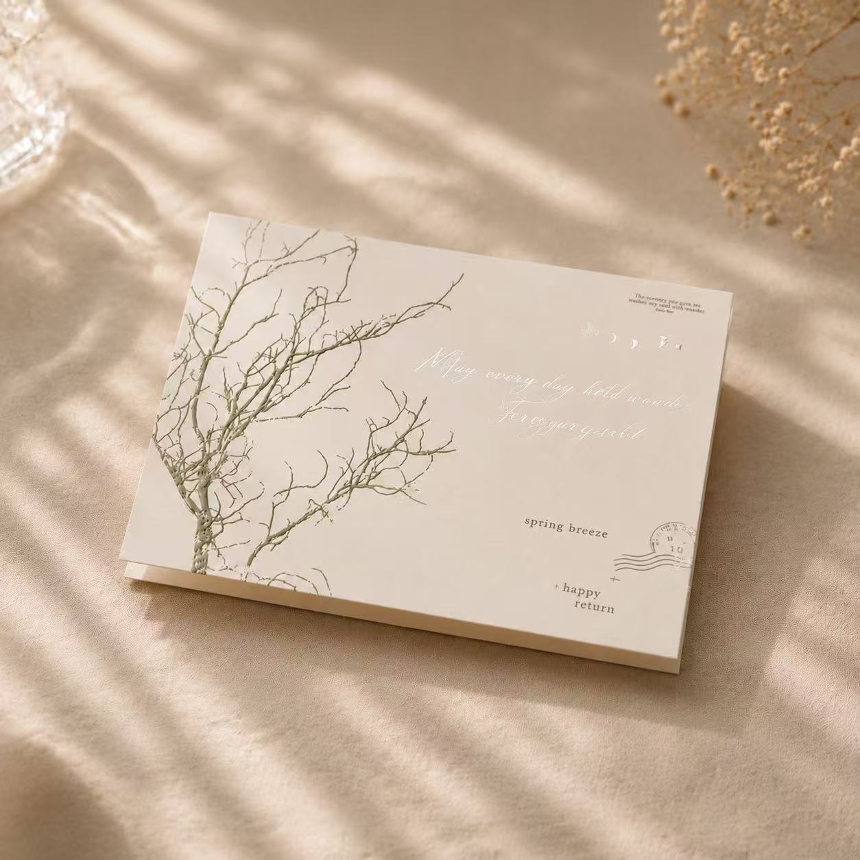 Dear Wilderness greeting card detail – bare branch illustration with spring breeze script on cream paper