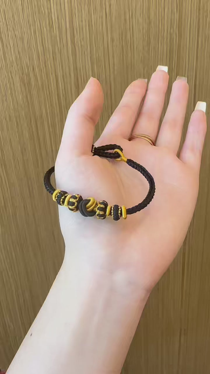 Quiet Joy | Black & Gold Handwoven Knot Bracelet